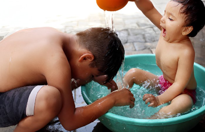 Brother and Sister Enjoying Bath